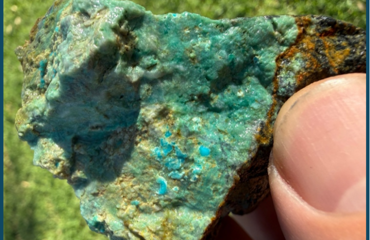 Close-up of a turquoise mineral specimen with vibrant blue-green hues.