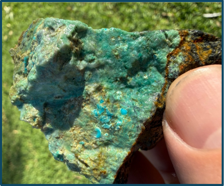 Close-up of a turquoise mineral specimen with vibrant blue-green hues.