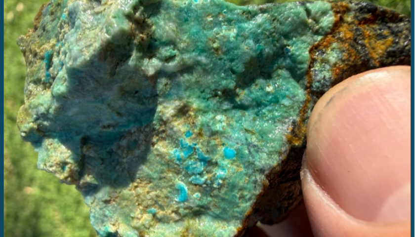 Close-up of a turquoise mineral specimen with vibrant blue-green hues.